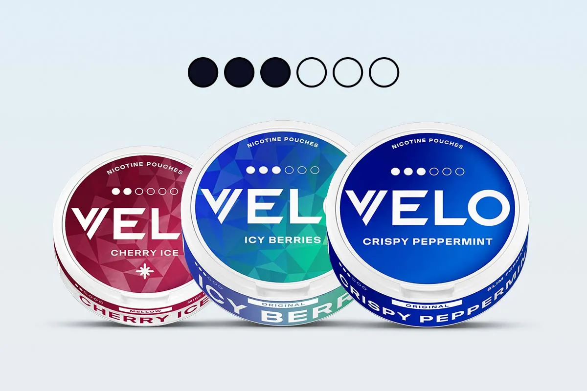 VELO nicotine pouches: Cherry Ice, Icy Berries and Crispy Peppermint cans under the VELO dot strength scale