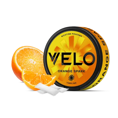 VELO Orange Spark nicotine pouches can in orange and yellow with the tingling marking, shown with fresh orange slices and slim white pouches