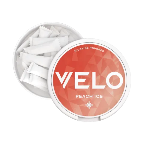 Open VELO Peach Ice can showing slim white tobacco-free nicotine pouches and the catch lid compartment