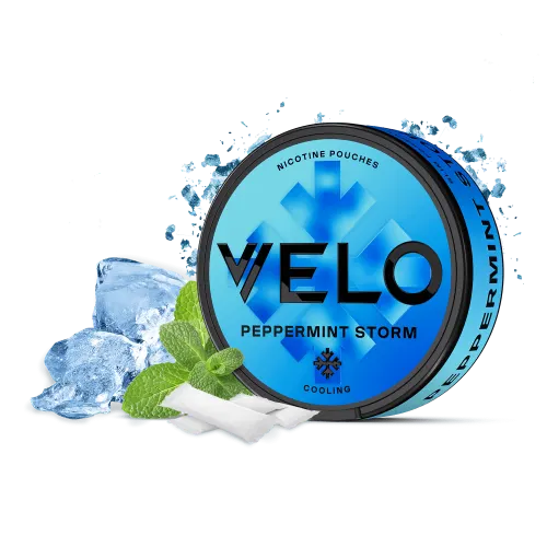 VELO Peppermint Storm nicotine pouches can in blue with a snowflake and cooling label, shown with ice cubes, mint leaves and slim white pouches