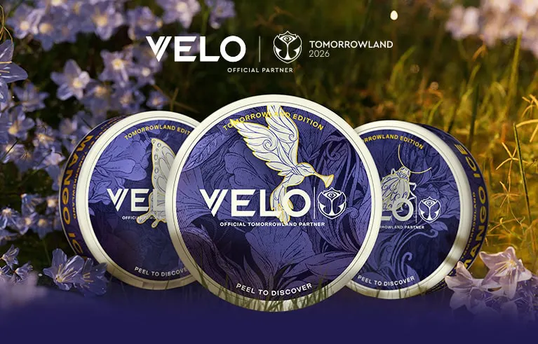 Official VELO Tomorrowland 2026 partner banner showing three limited edition nicotine pouch cans