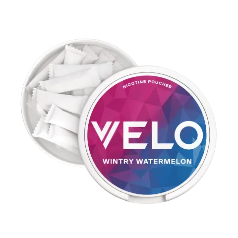 Open VELO Wintry Watermelon can showing the slim white tobacco-free nicotine pouches inside and the catch lid compartment