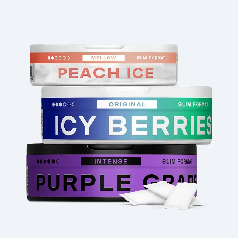 VELO Peach Ice Mellow Mini, Icy Berries Original Slim and Purple Grape Intense Slim cans stacked to show VELO's three strength ranges