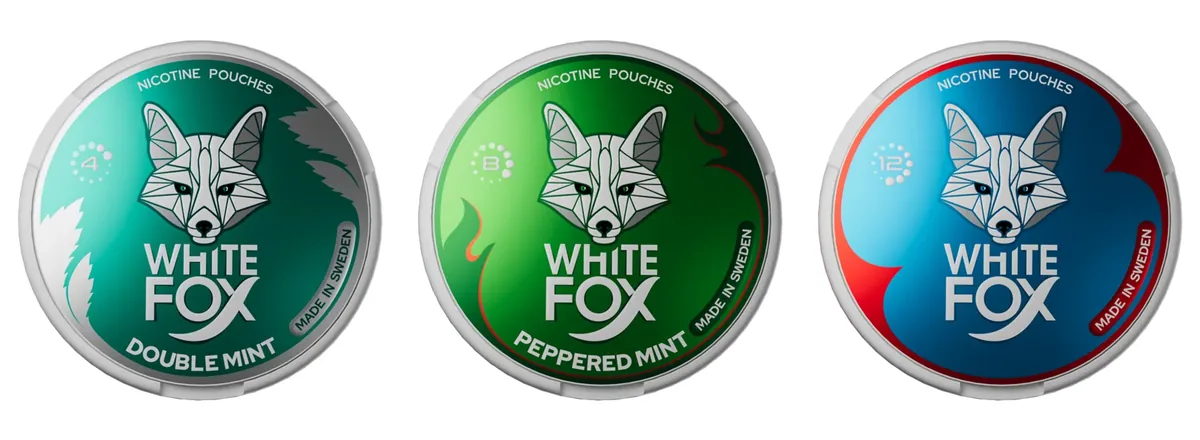 Three official White Fox nicotine pouch lids: Double Mint with a 4 in the dot ring, Peppered Mint with an 8 and Mint with a 12, the per-gram strengths of the Smooth, Balanced and Intense cans