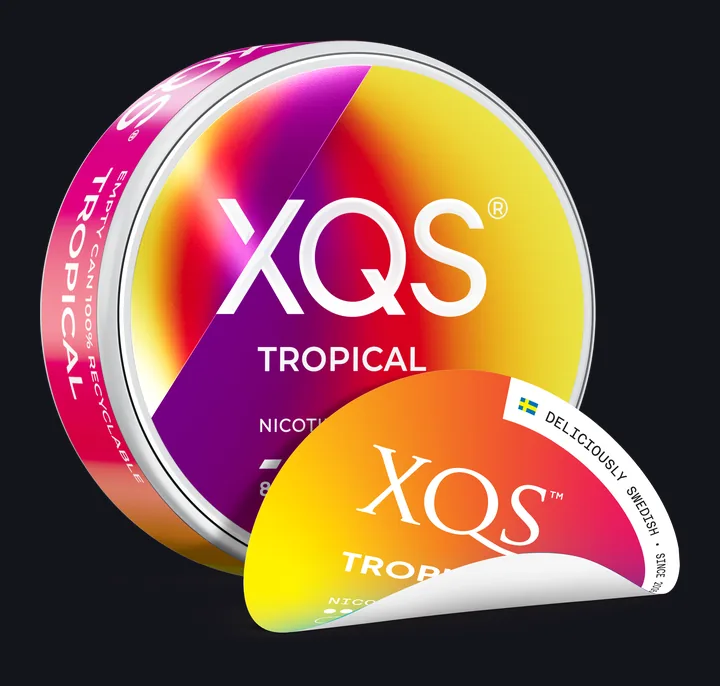 XQS Tropical 8mg nicotine pouches can in the 2026 design, with the older lid design peeled away behind it
