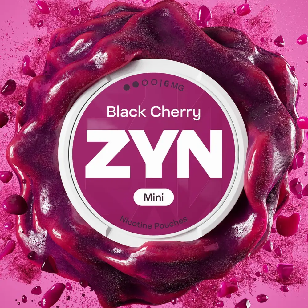 Official ZYN Black Cherry nicotine pouches Mini 6mg can on a dark cherry splash background