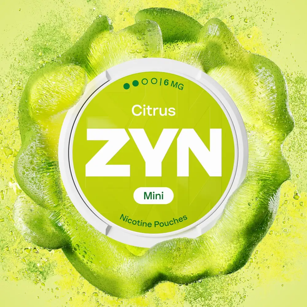 Official ZYN Citrus nicotine pouches Mini 6mg can surrounded by a burst of lime zest