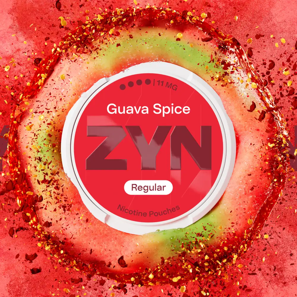 Official ZYN Guava Spice nicotine pouches Regular 11mg can surrounded by guava flesh and chili flakes